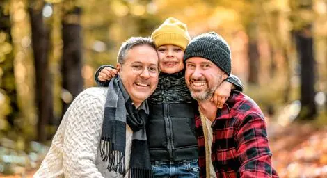 two-men-outdoors-with-little-boy-standing-between-them